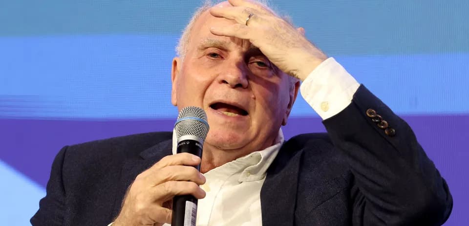 Man speaking into microphone at event