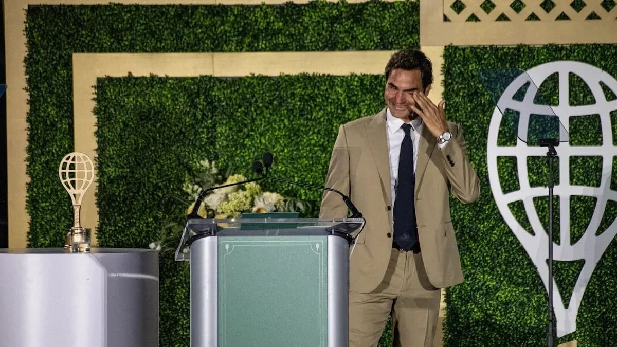 Roger Federer speaking at an award ceremony podium