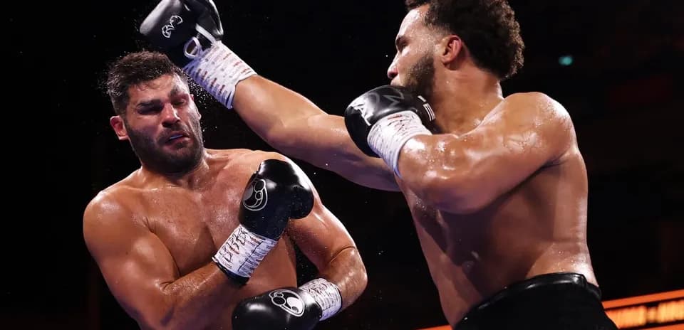 Boxers exchanging punches in the ring