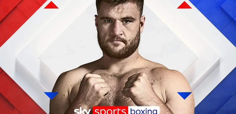 Boxer posing with fists up against a colorful background