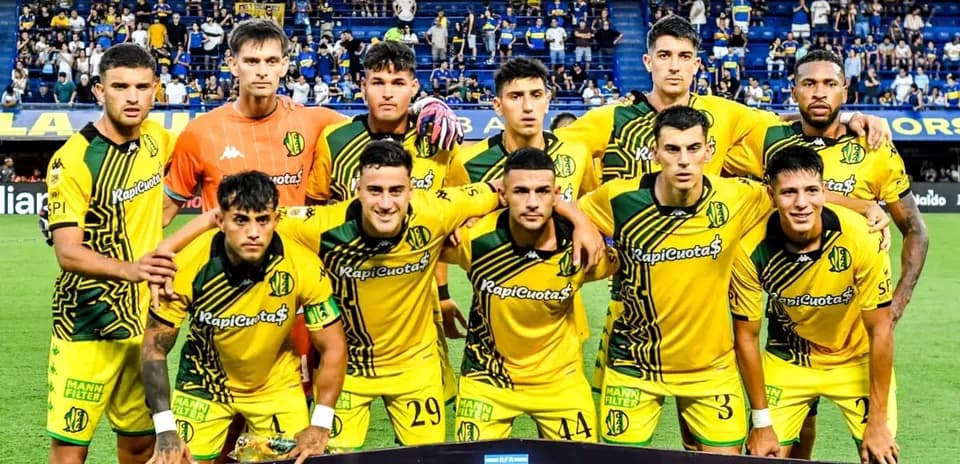 Football team posing for photo before match