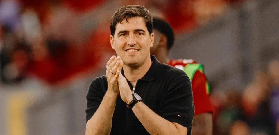 Coach clapping during match on the sideline