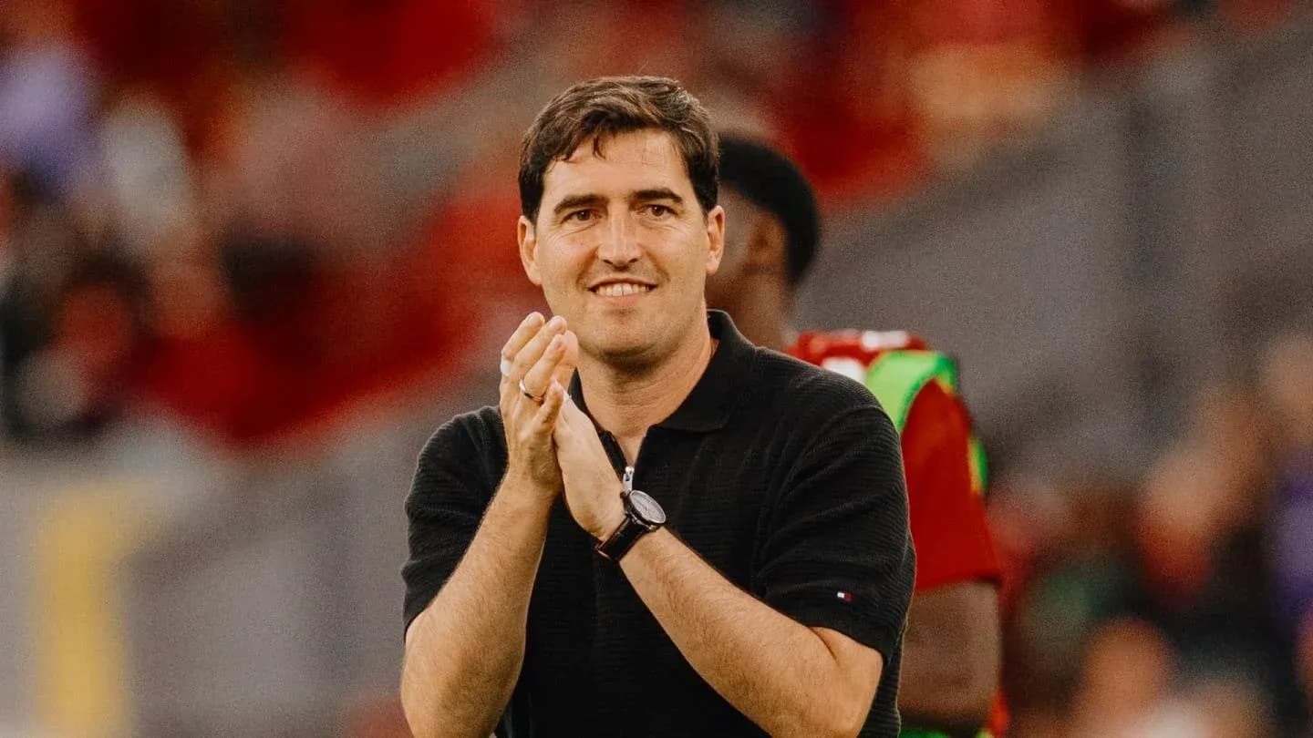 Coach clapping during match on the sideline