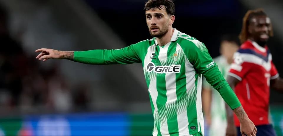 Player in green jersey signaling during match