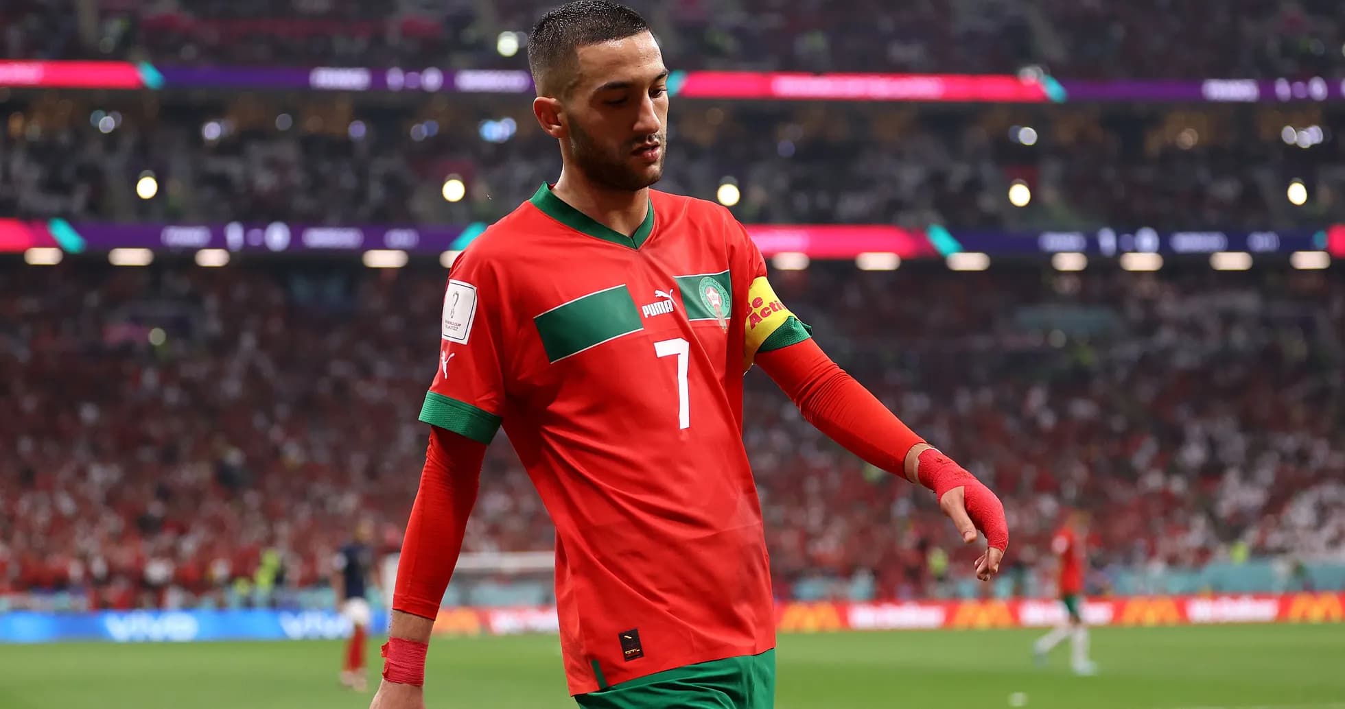 Hakim Ziyech walking on the pitch in Morocco jersey