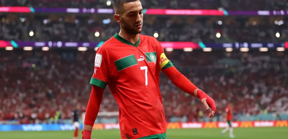 Hakim Ziyech walking on the pitch in Morocco jersey