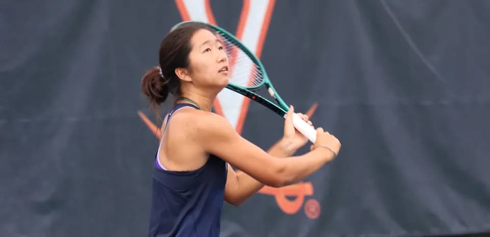 Tennis player preparing to hit a serve