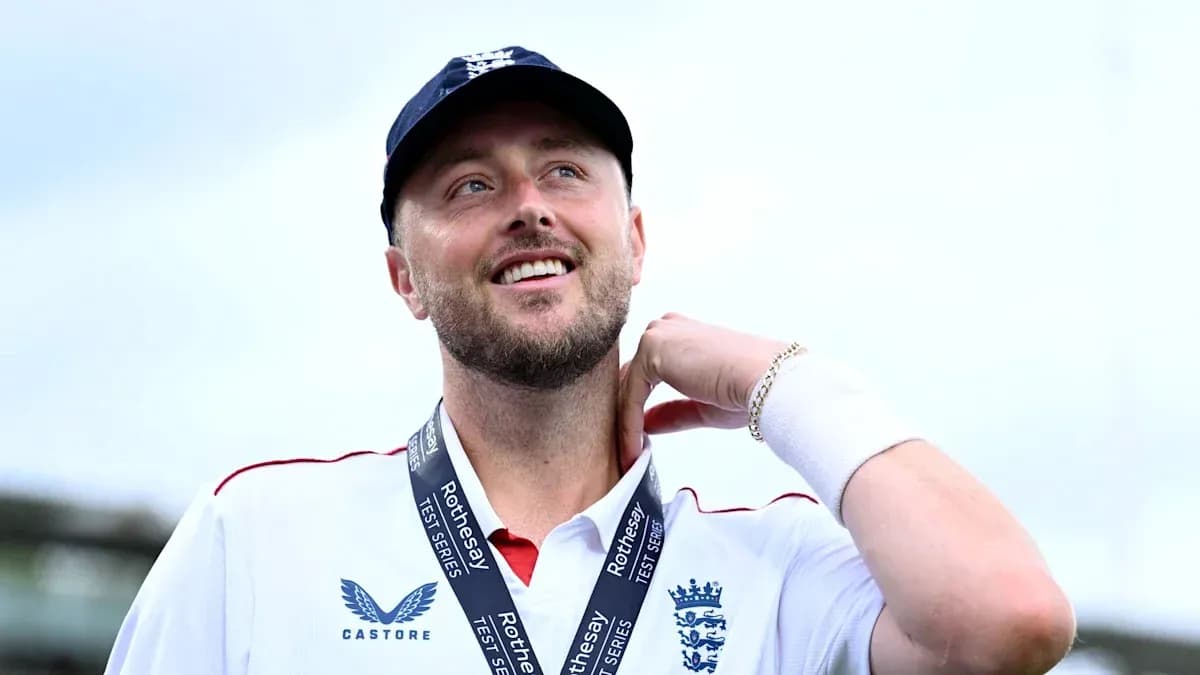 Cricketer wearing medal and smiling at event