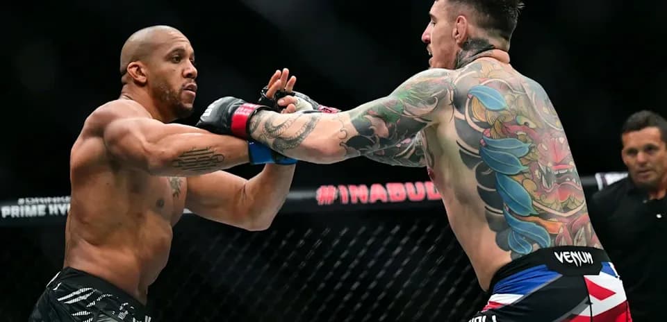 Two fighters exchanging punches in the octagon