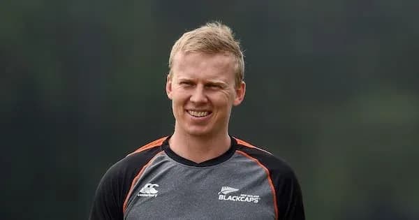 Cricketer in Blackcaps training uniform smiling