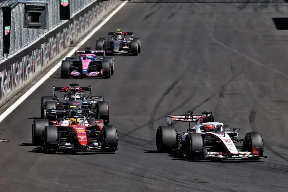Multiple Formula 1 cars racing on track