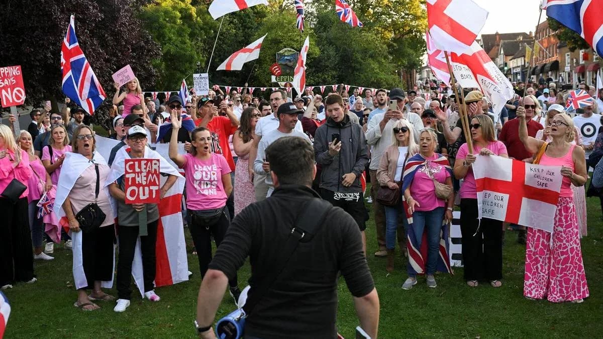 Crowd protesting with banners and flags in park