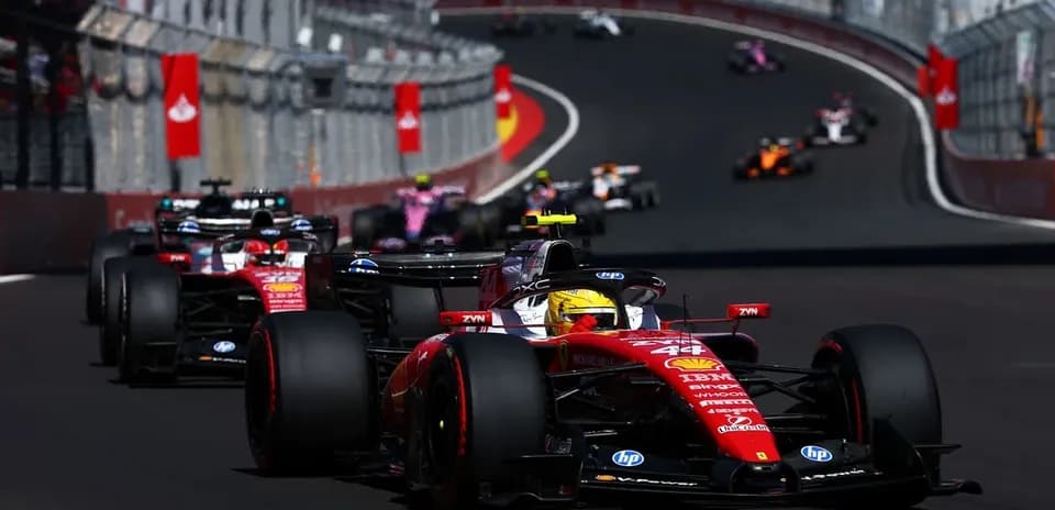 Ferrari car leading other cars on racetrack