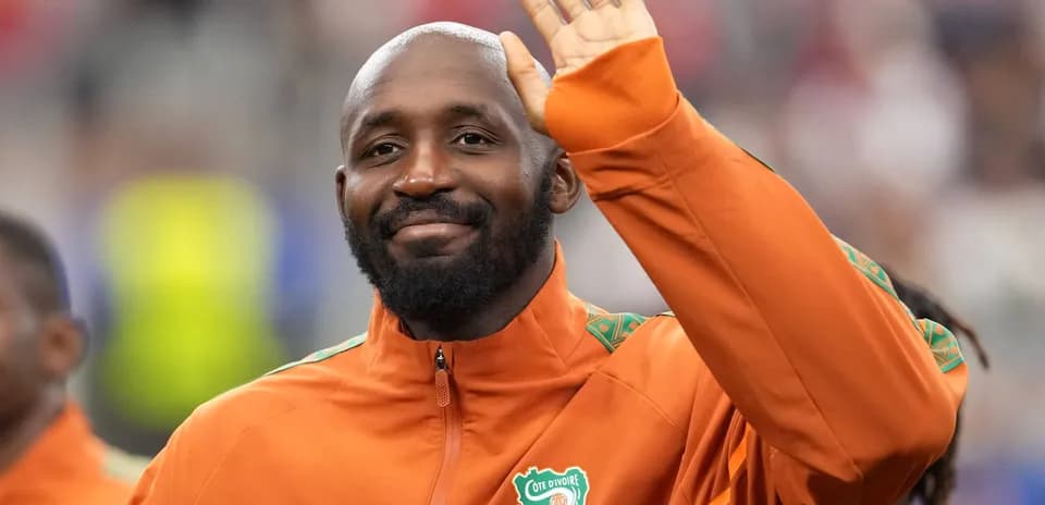 Player waving during team introduction on field