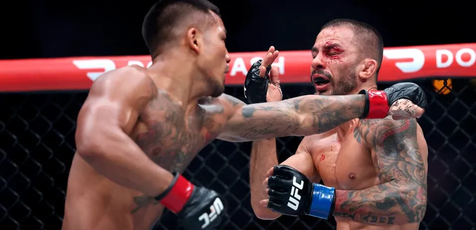 Fighter landing a punch in MMA match