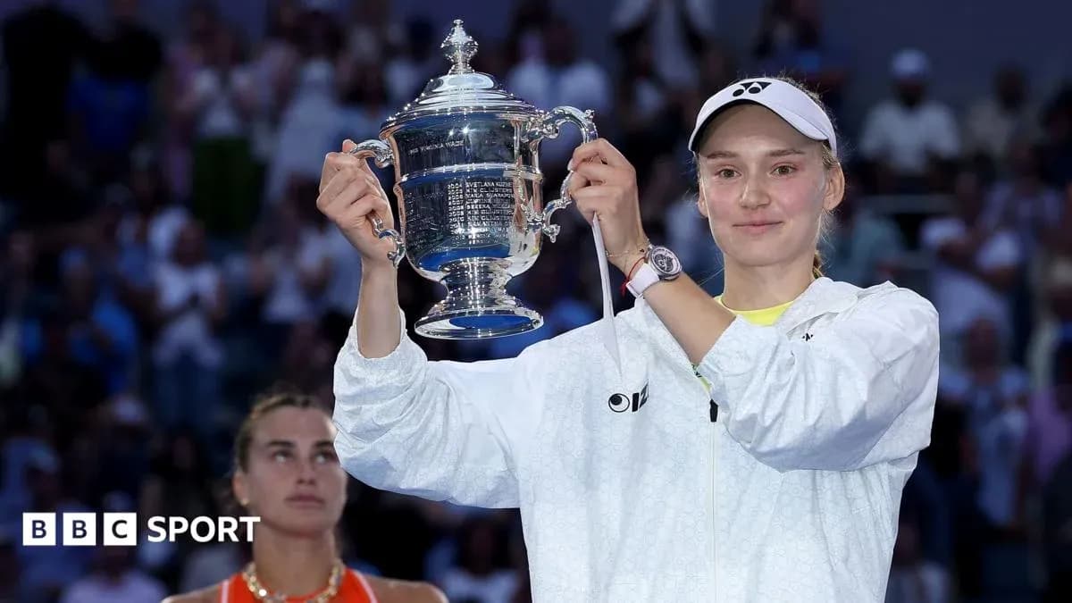 Player holding trophy with runner-up in background