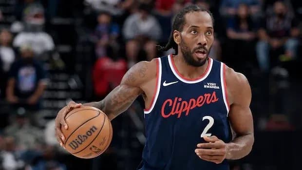 Player dribbling basketball during game action
