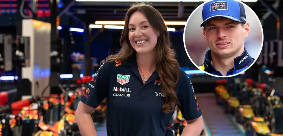 Woman in Red Bull Racing uniform in garage