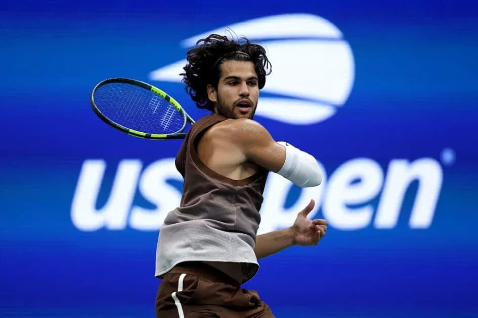 Player hitting backhand during US Open match