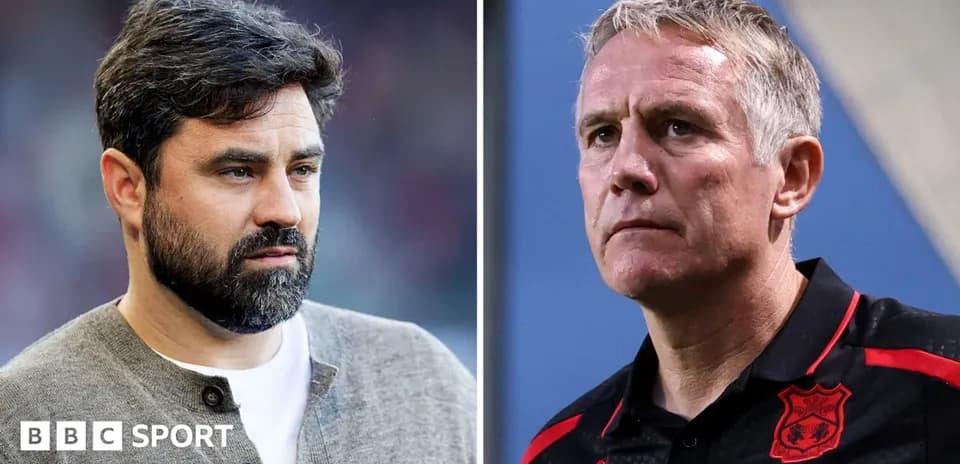 Two football managers during a match discussion