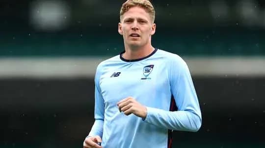 Player jogging during training session in blue kit