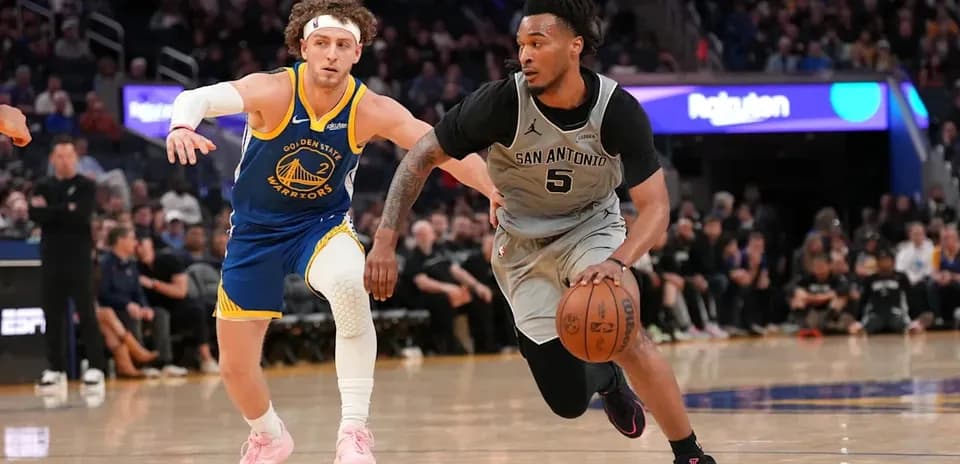 Player dribbling ball while being closely guarded