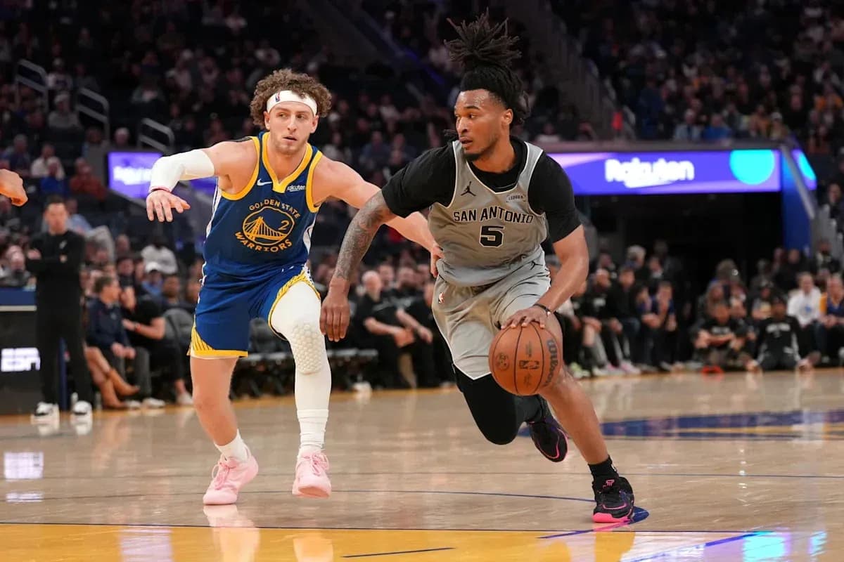 Player dribbling ball while being closely guarded