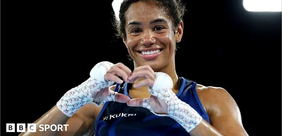 Female boxer making a heart shape with hands