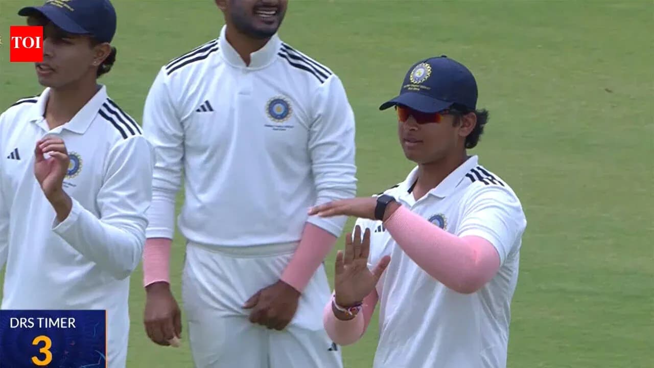 Cricket players discussing strategy during match Cricket players discussing strategy during match