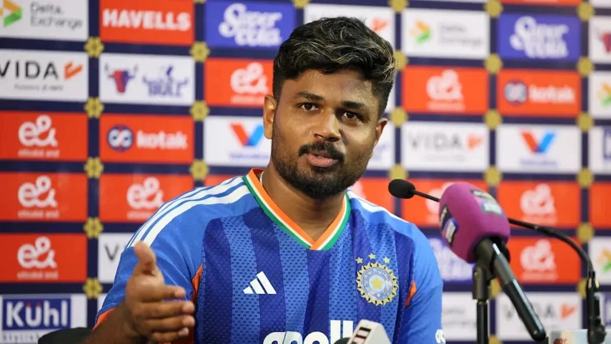 Player speaking at press conference with microphone Player speaking at press conference with microphone