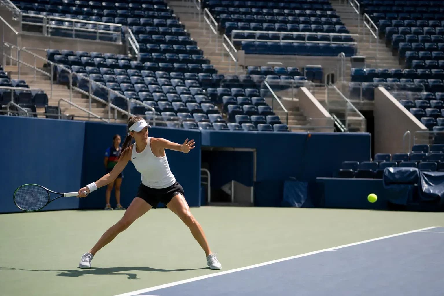 Female tennis player preparing to hit a ball Female tennis player preparing to hit a ball