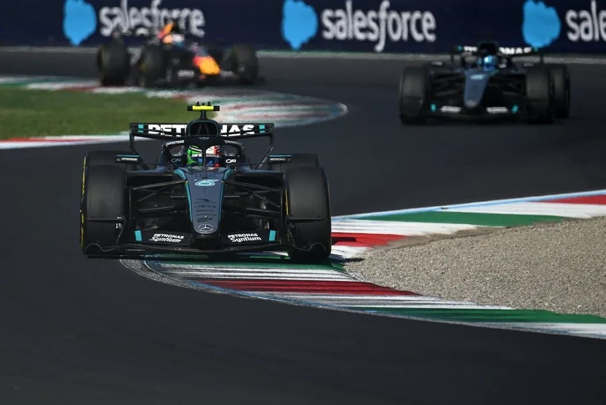 Mercedes Formula 1 car navigating a track corner Mercedes Formula 1 car navigating a track corner
