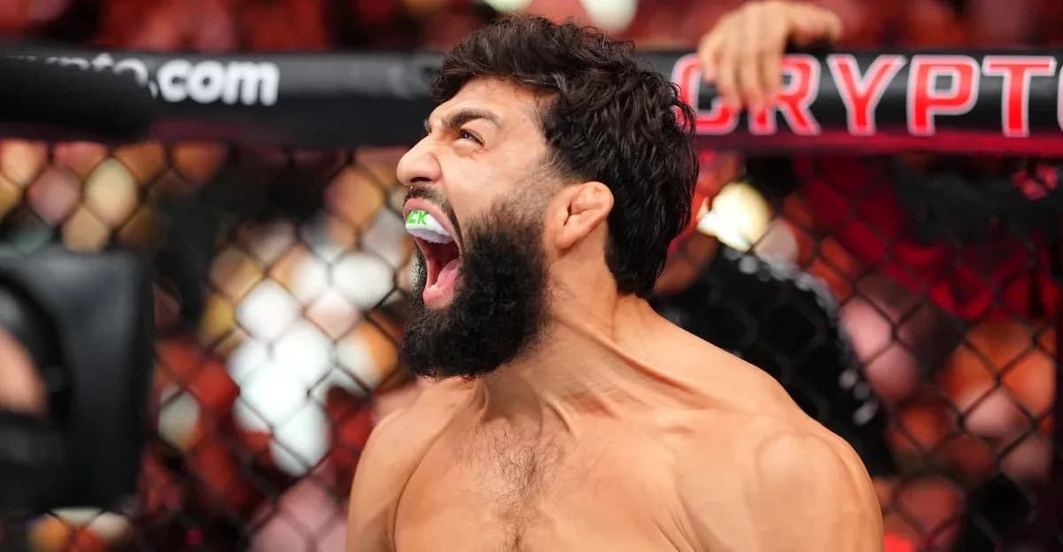 Fighter celebrating with mouthguard during match Fighter celebrating with mouthguard during match