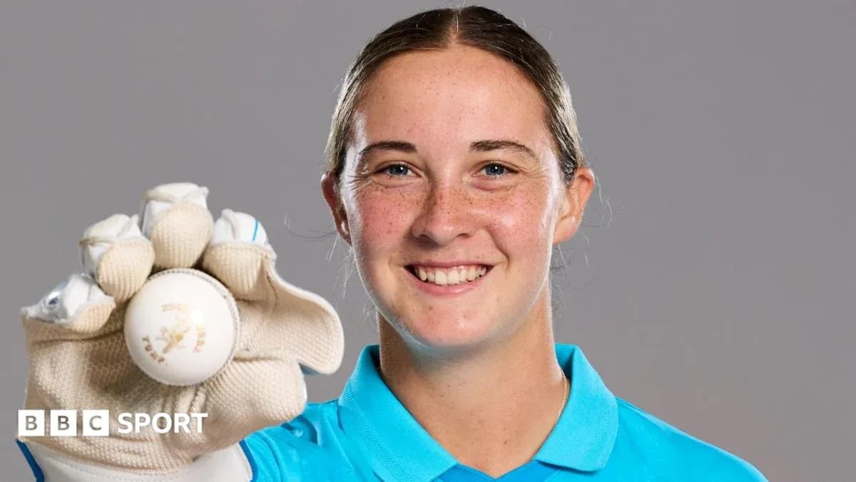 Player holding a cricket ball in glove Player holding a cricket ball in glove