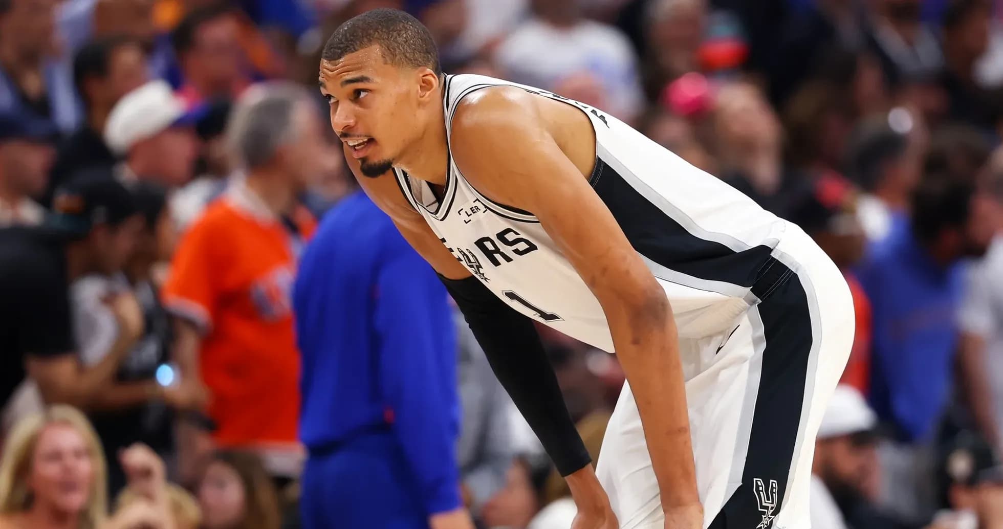 Player in Spurs uniform during basketball game Player in Spurs uniform during basketball game