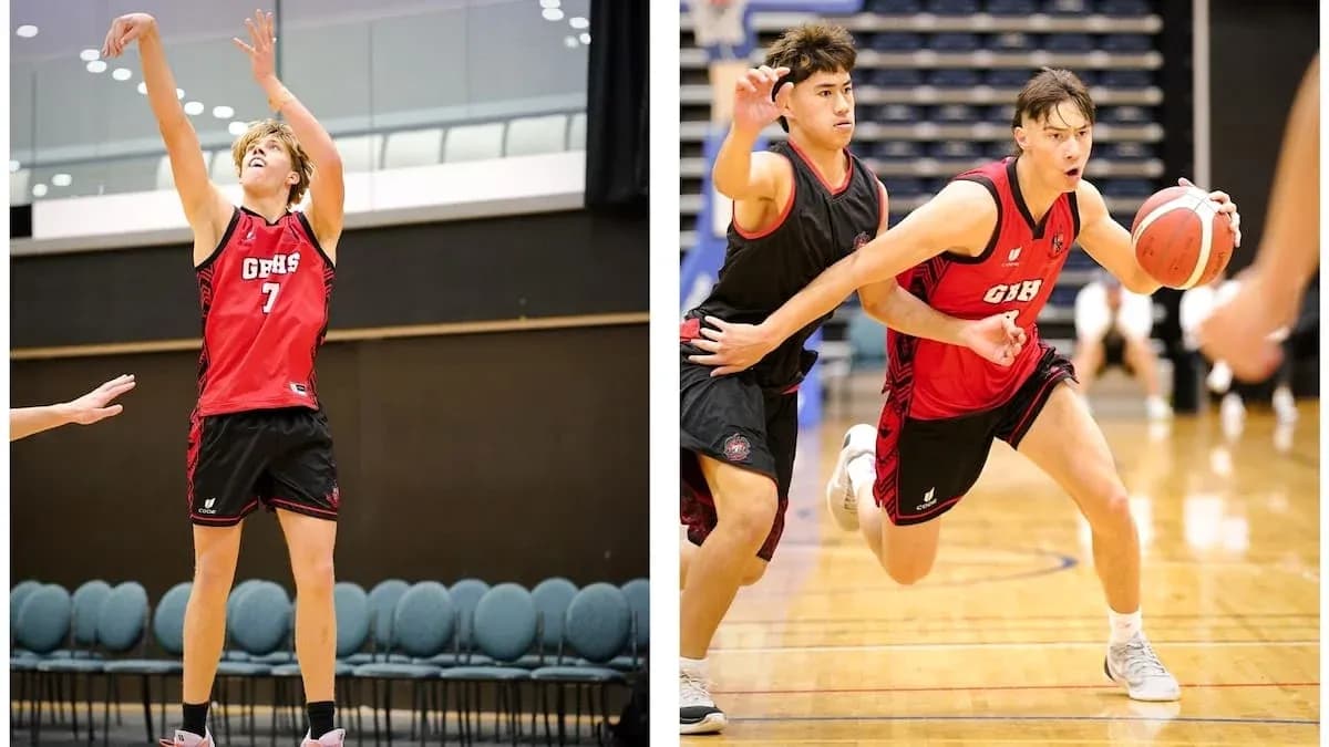 Two basketball players in action during a game Two basketball players in action during a game