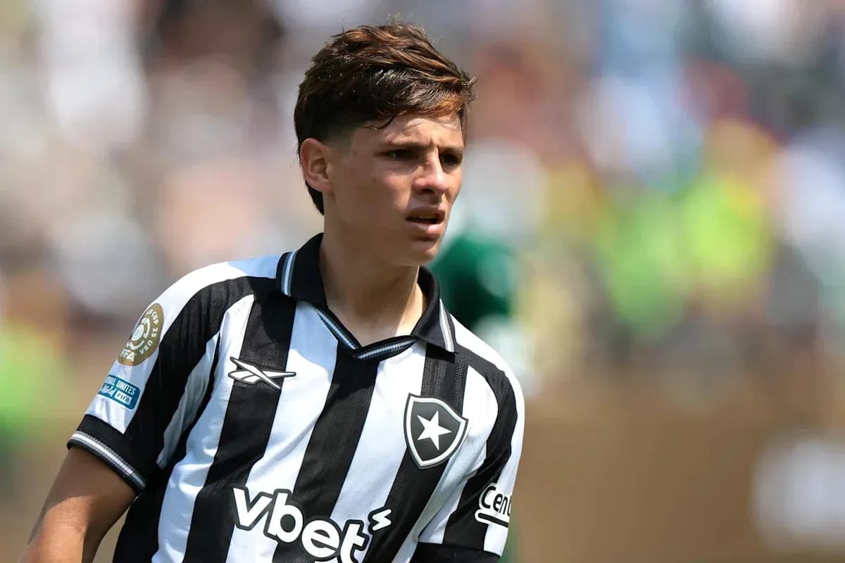 Player wearing black and white striped jersey on field Player wearing black and white striped jersey on field