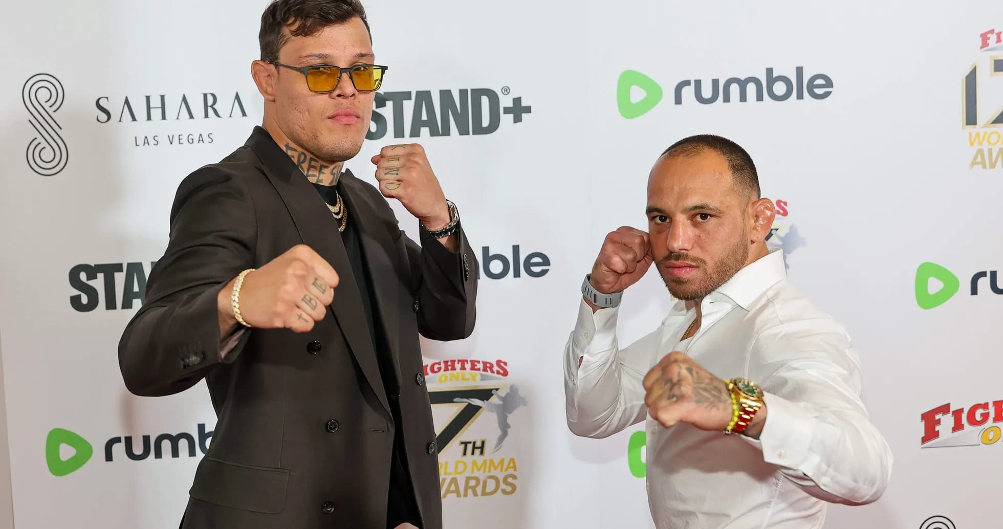 Two fighters posing at MMA awards event Two fighters posing at MMA awards event