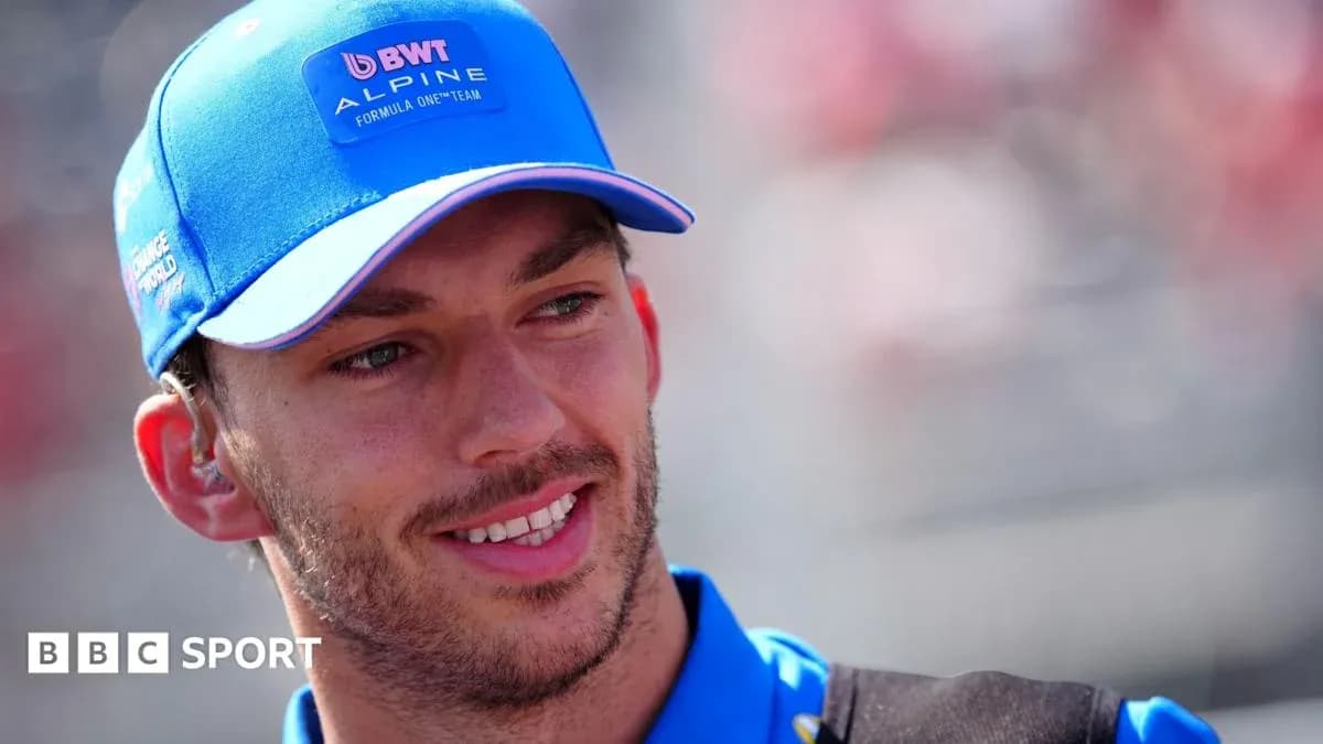 Driver wearing Alpine cap during event Driver wearing Alpine cap during event