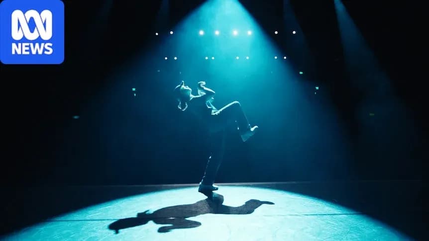 Dancer performing under spotlight on stage Dancer performing under spotlight on stage