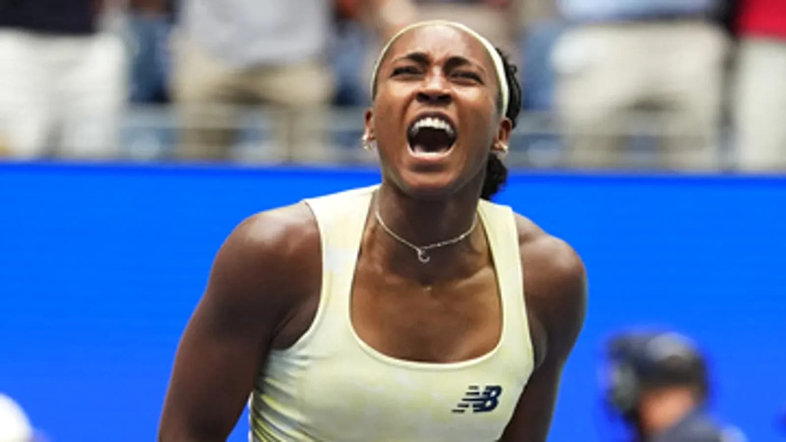 Tennis player celebrating during match at US Open Tennis player celebrating during match at US Open