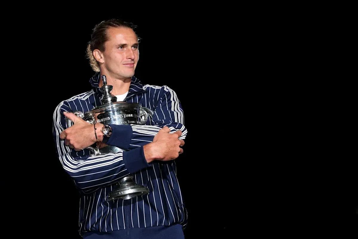 Player holding a trophy on stage Player holding a trophy on stage
