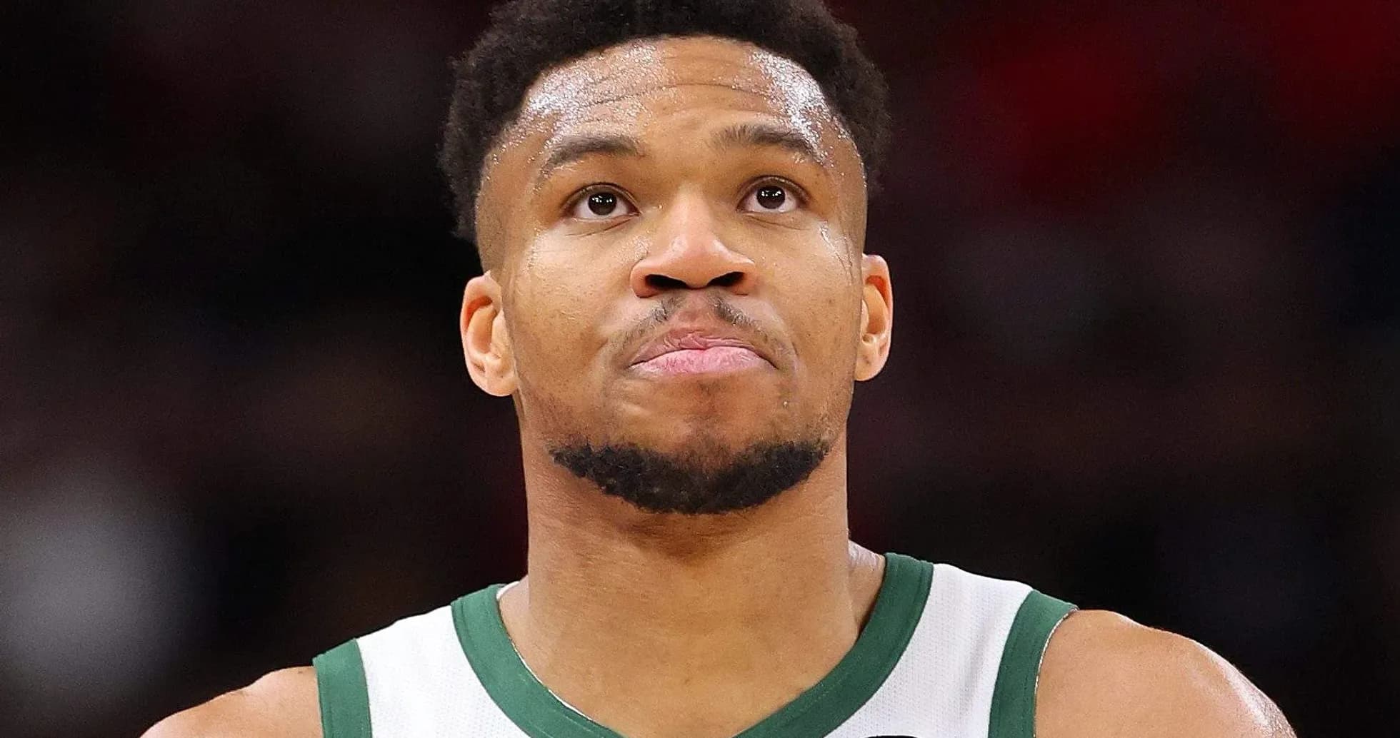 Basketball player looking up during game Basketball player looking up during game