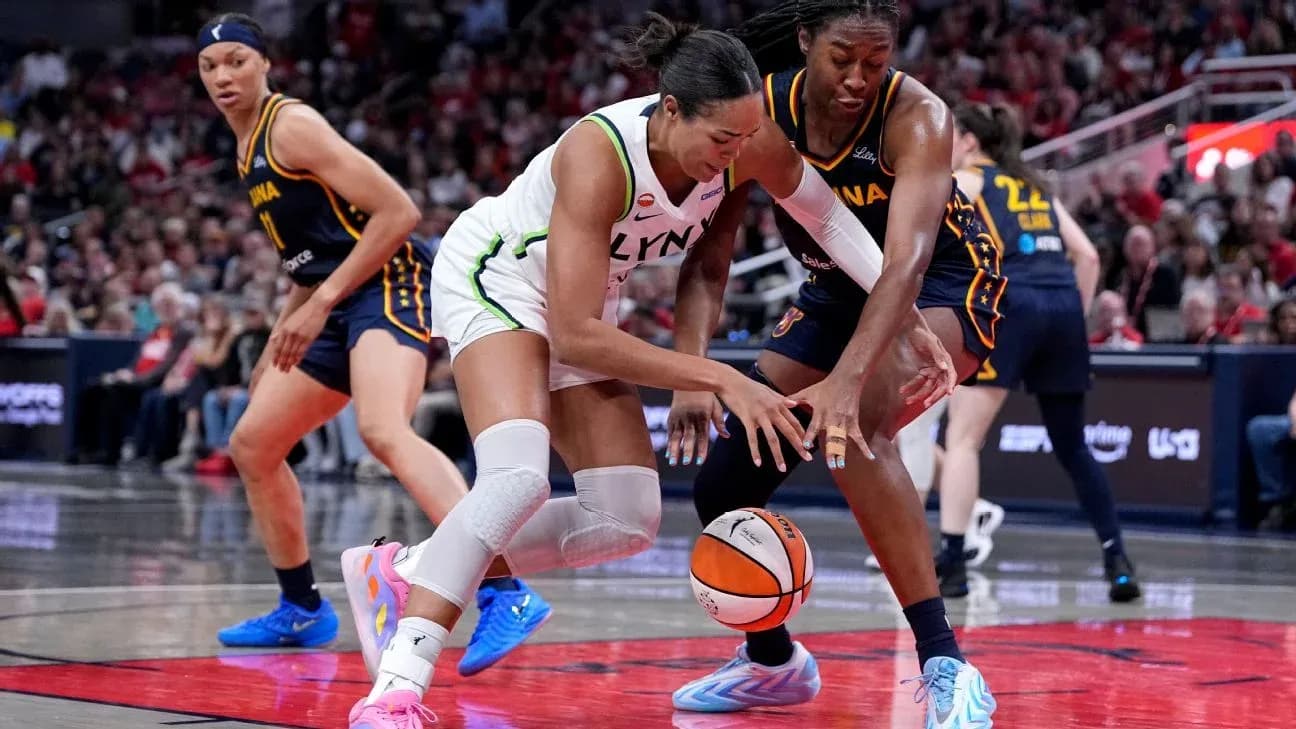 Players battling for the basketball during game Players battling for the basketball during game