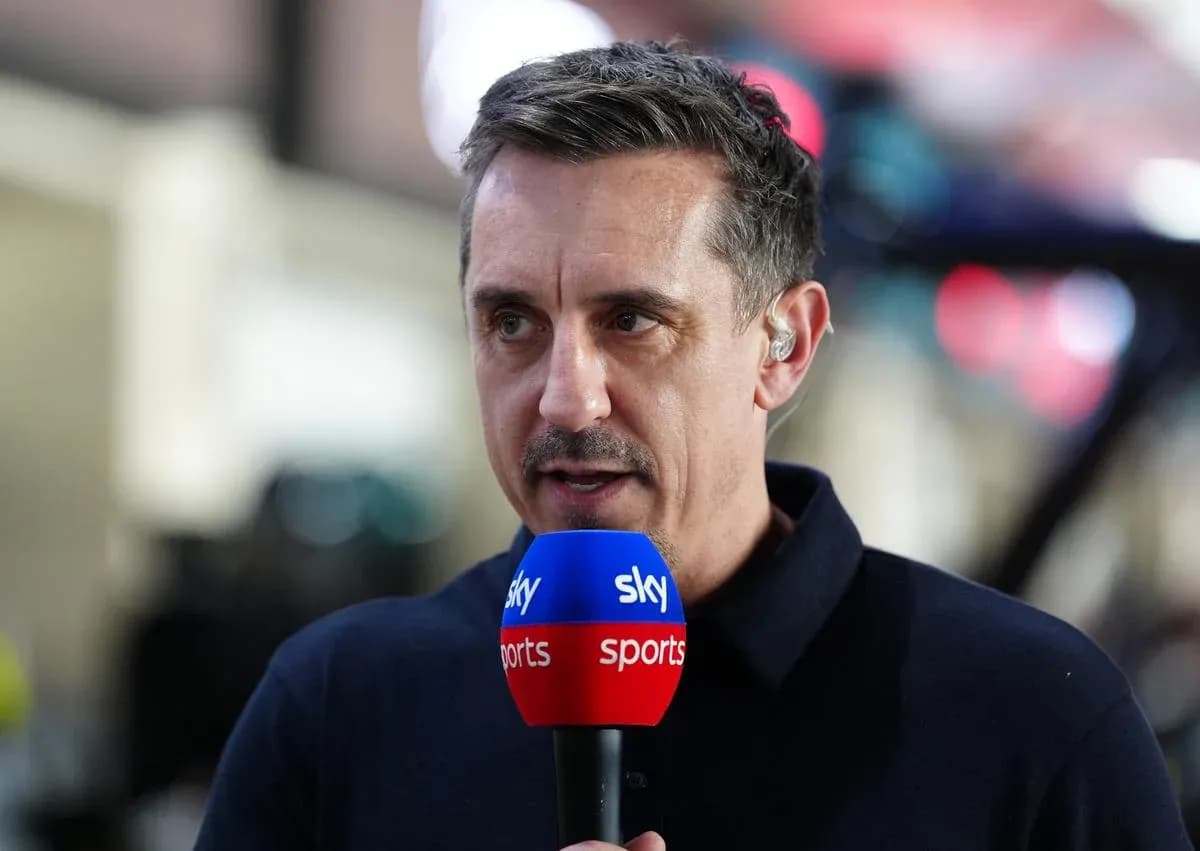 Sports commentator speaking into microphone on set Sports commentator speaking into microphone on set
