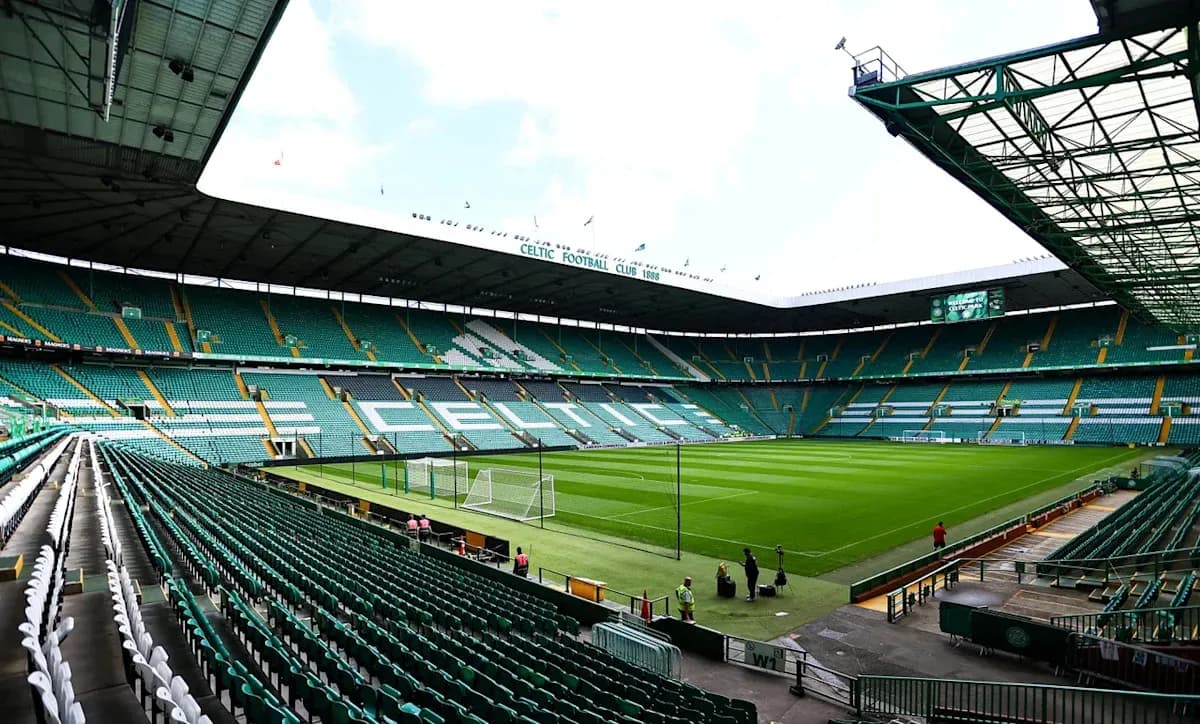 Empty Celtic Park stadium with green seats and pitch Empty Celtic Park stadium with green seats and pitch
