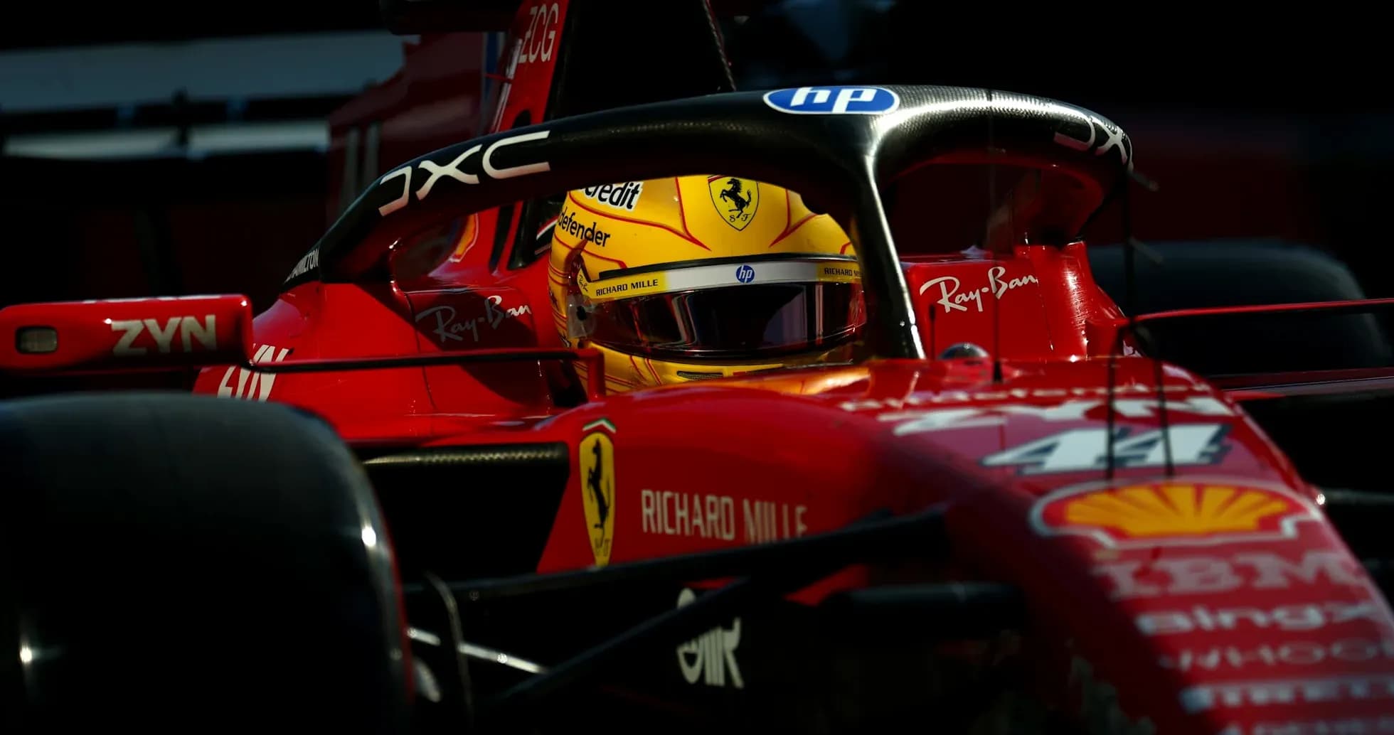 Driver in Ferrari car during a race event Driver in Ferrari car during a race event
