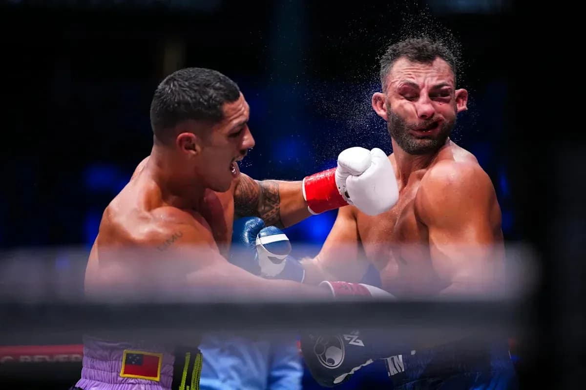 Boxers exchanging punches during a boxing match Boxers exchanging punches during a boxing match