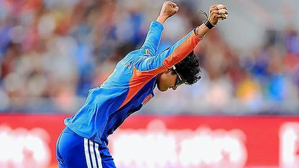 Cricketer celebrating a wicket during a match Cricketer celebrating a wicket during a match