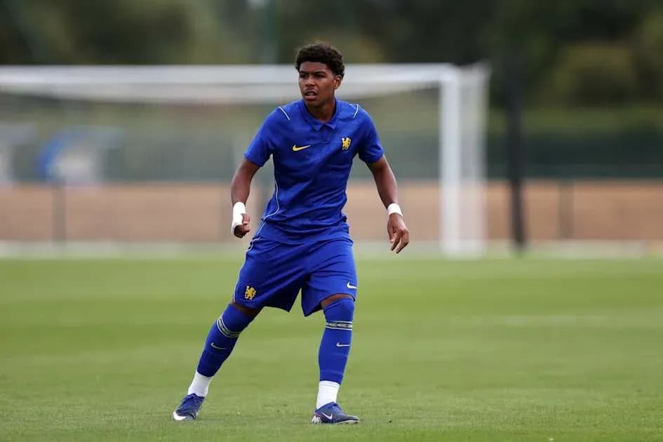Player in blue kit running on training pitch Player in blue kit running on training pitch